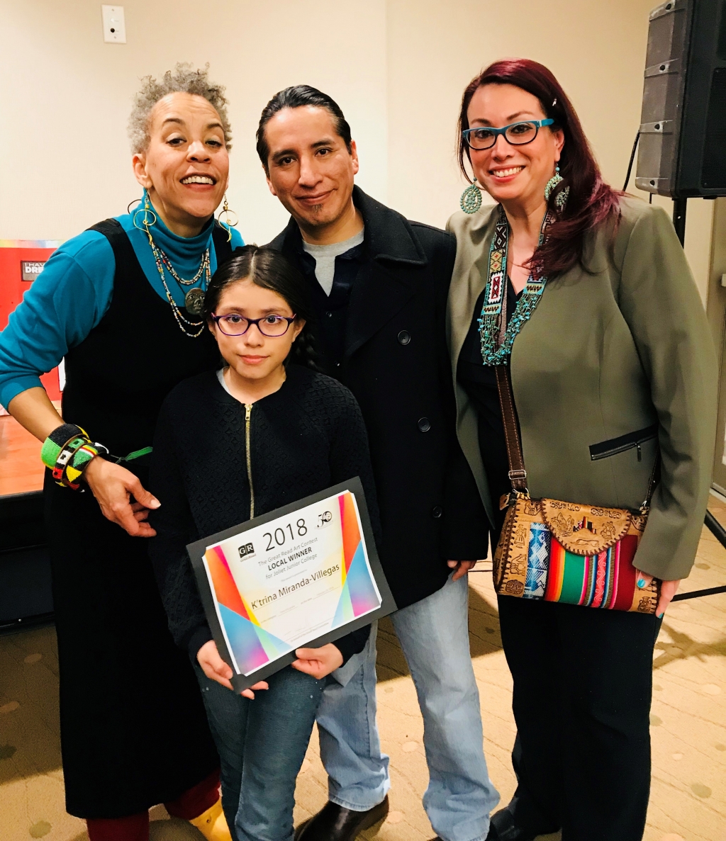 Musician Maggie Brown with JJC art contest winner K'trina Miranda Villegas and her family.