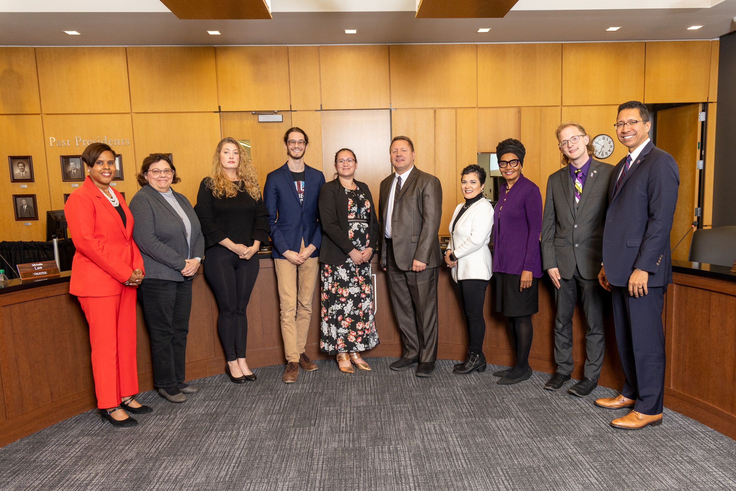 Pictured are Dr. Yolanda Farmer, Diane Harris, Michelle Lee, Maureen Broderick, Ryan Queeney, James Budzinski, Nancy Garcia Guillen, Alicia Morales, Joshua Stamborski and Dr. Clyne Namuo as they pose for photo in JJC board room