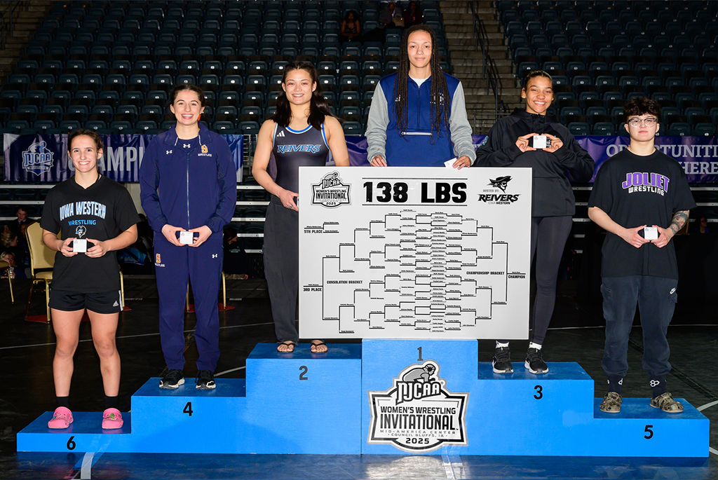 six wrestlers in 138 lb division stand on podiun after wrestling meet