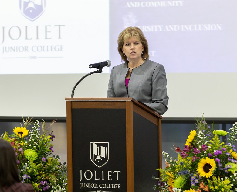 Dr. Mitchell delivering her State of the College address.