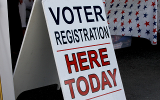 "voter registration here today" sign