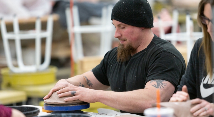 participant making a bowl for the luncheon