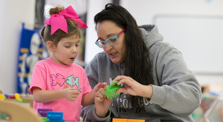 student working with child in ECC
