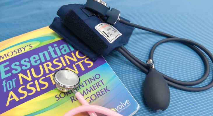 nursing book and stethoscope