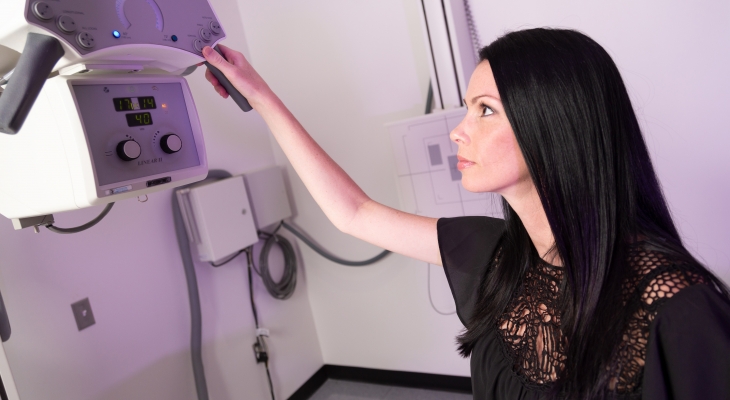 student using xray machine