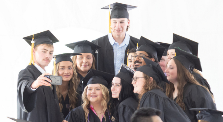 graduates get together for a photo