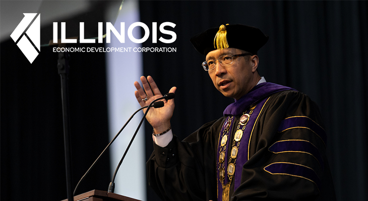 dr namuo at the podium with illinois edc logo 