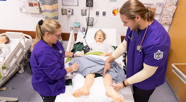 two nursing students in simulation lab