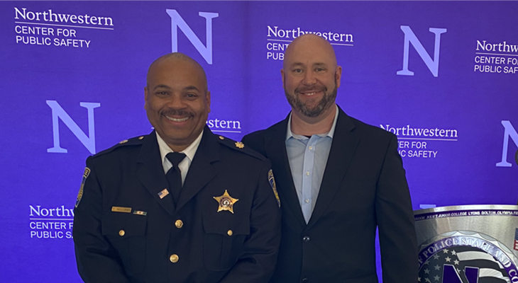 Commander Tracy Williams and Sergeant Tom Glisson pose for photo