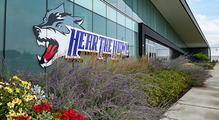 hear the howl wolf decal on side of building