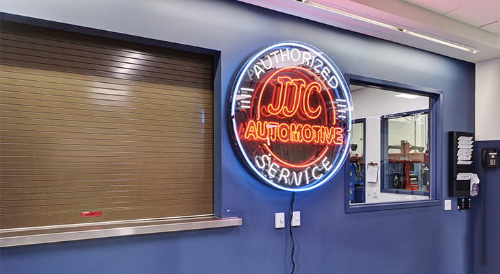 JJC automotive authorized service neon sign on wall
