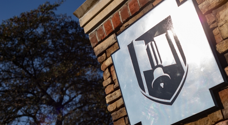 JJC belltower shield logo on entrance sign